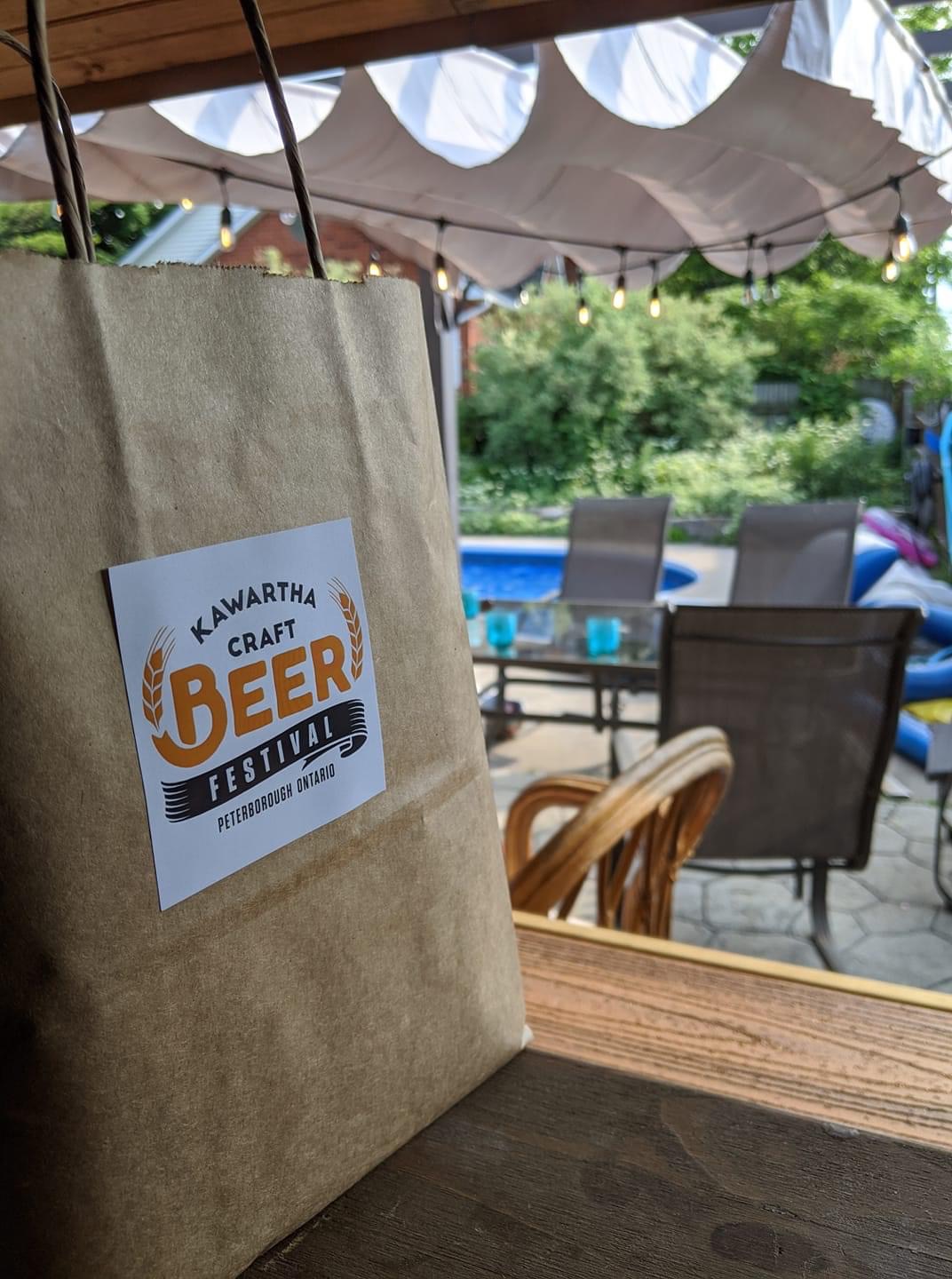a brown bag with the sticker reading Kawartha Craft Beer Festival