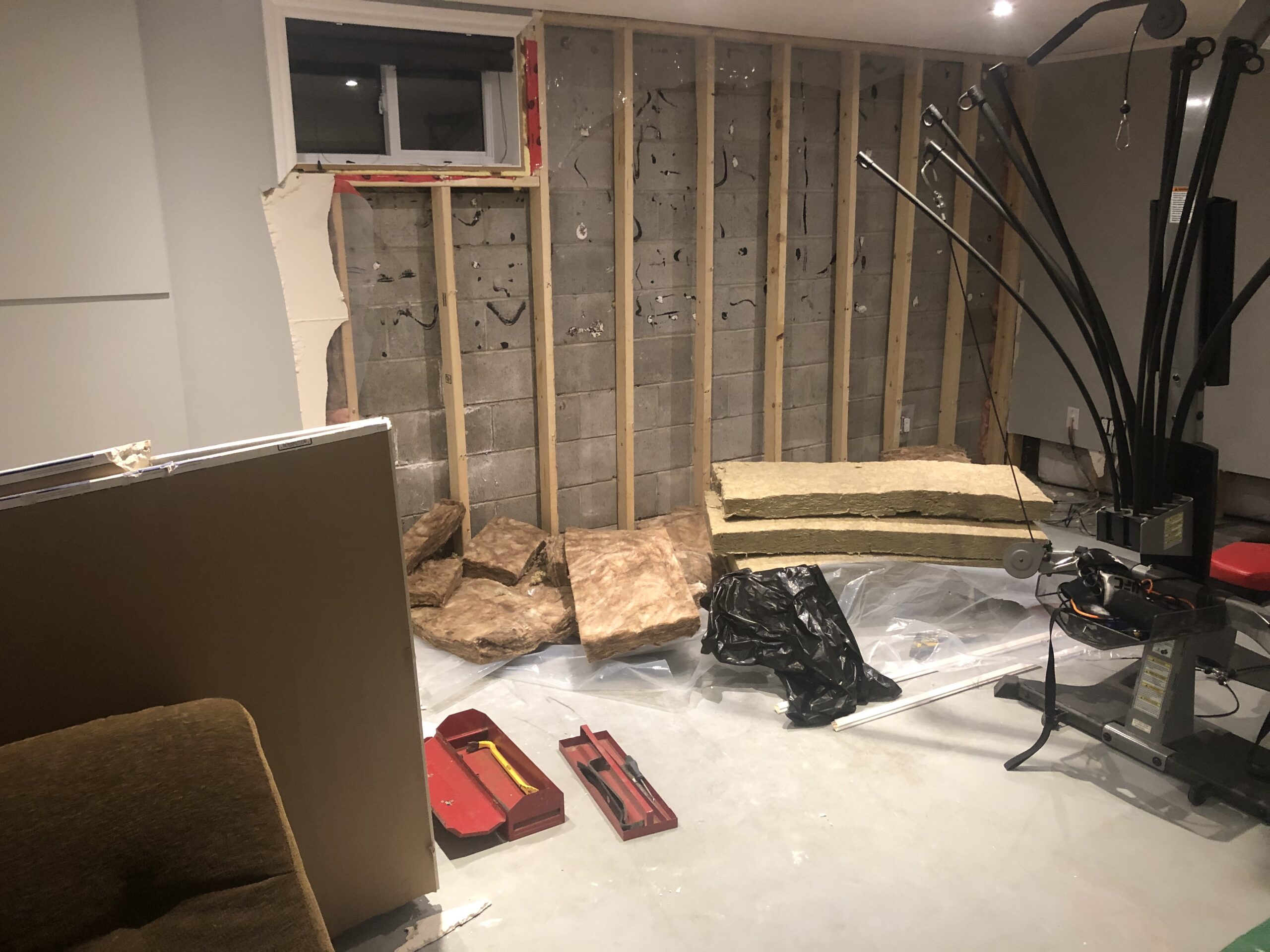 a basement under construction with wooden frame in the walls