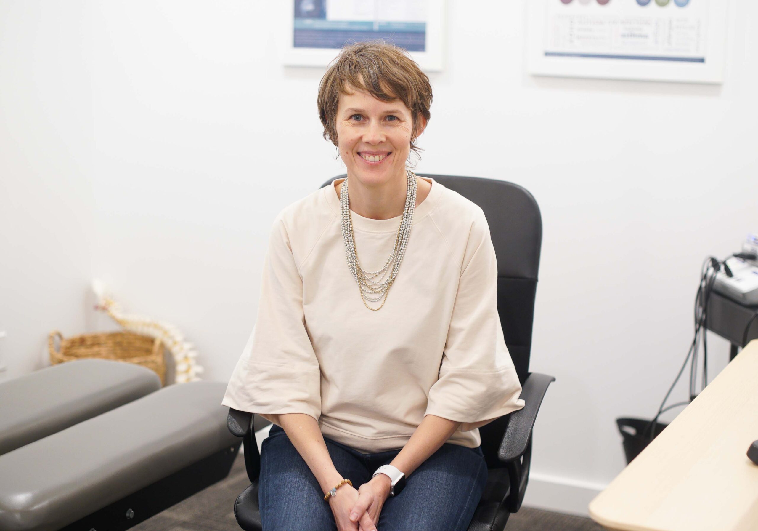 Dr. Ange Wellman sitting in a chair