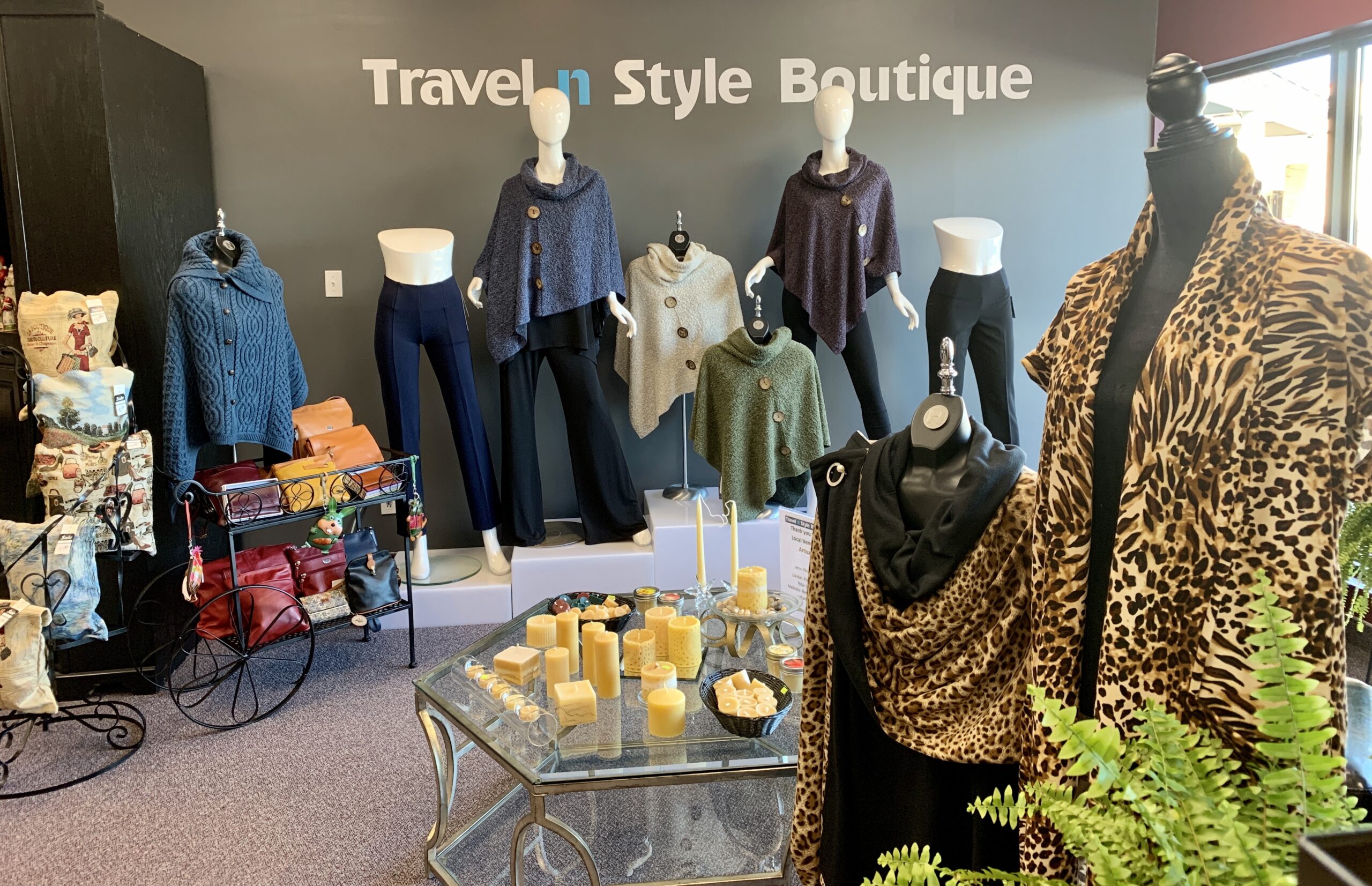 travel n style boutique's clothes and gift items on display