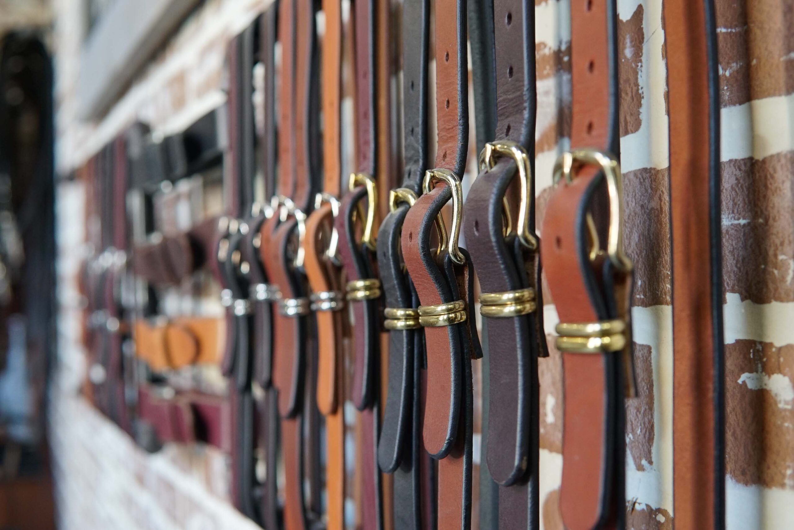 leather belts on display in a shop