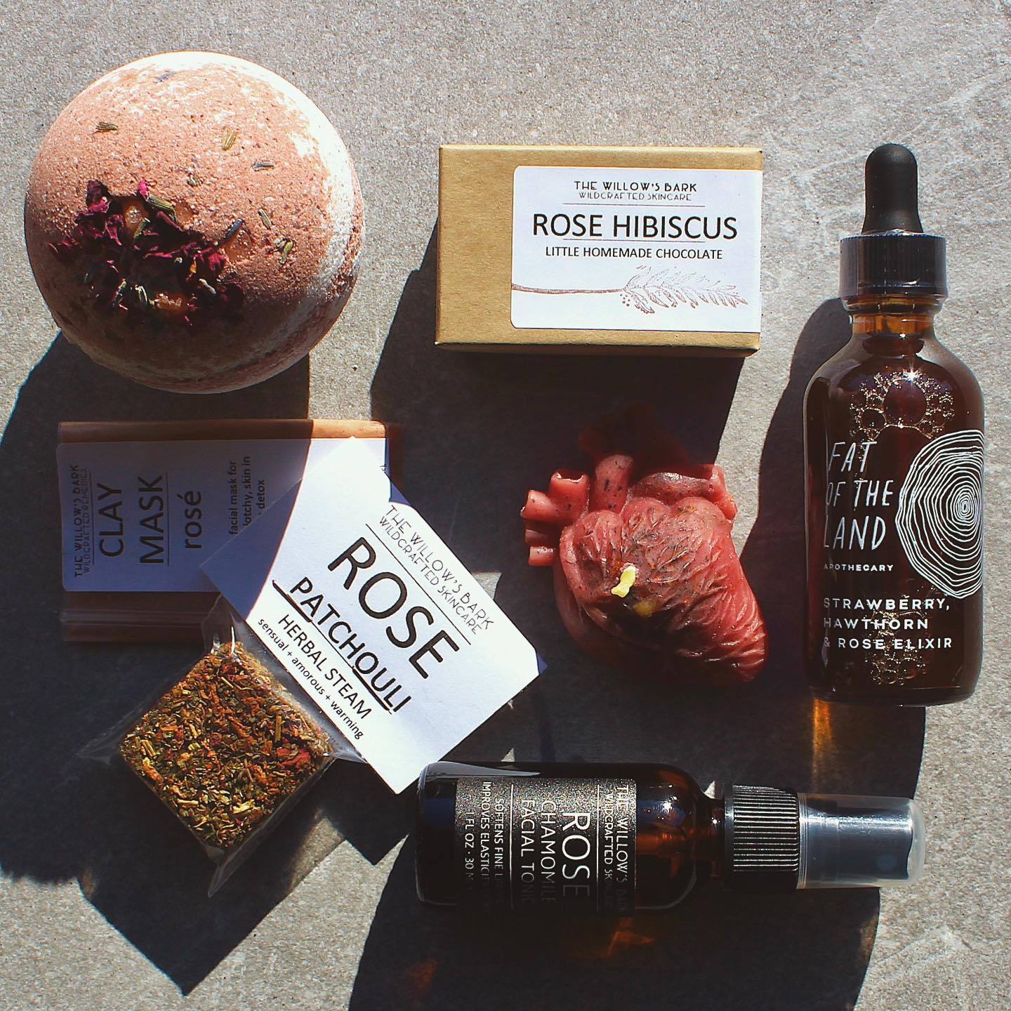 natural skincare products arranged on a stone
