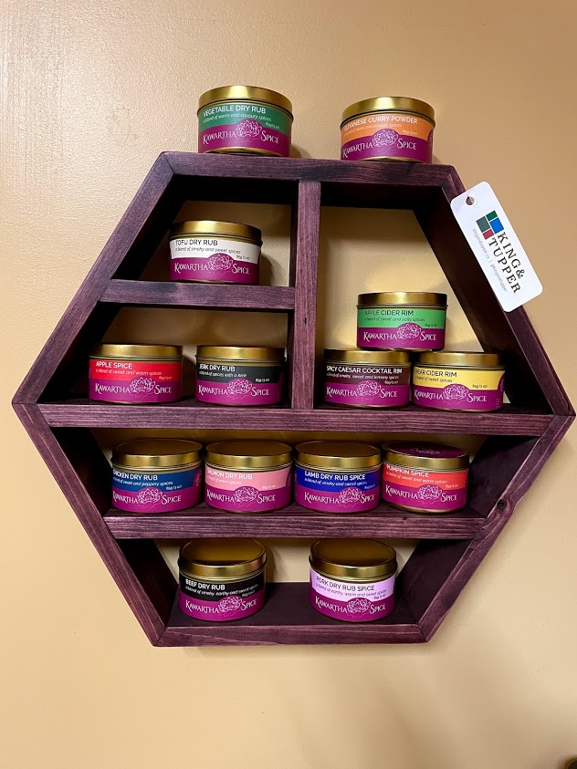 Kawartha spices arranged in a wall mounted shelf