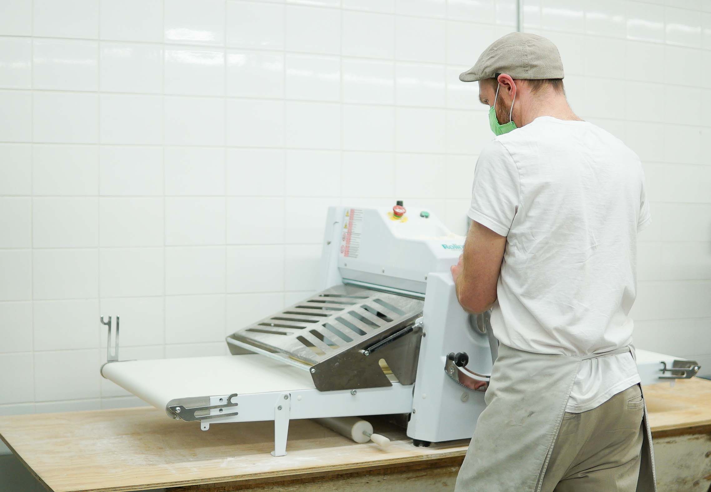 a man working with bakery machine