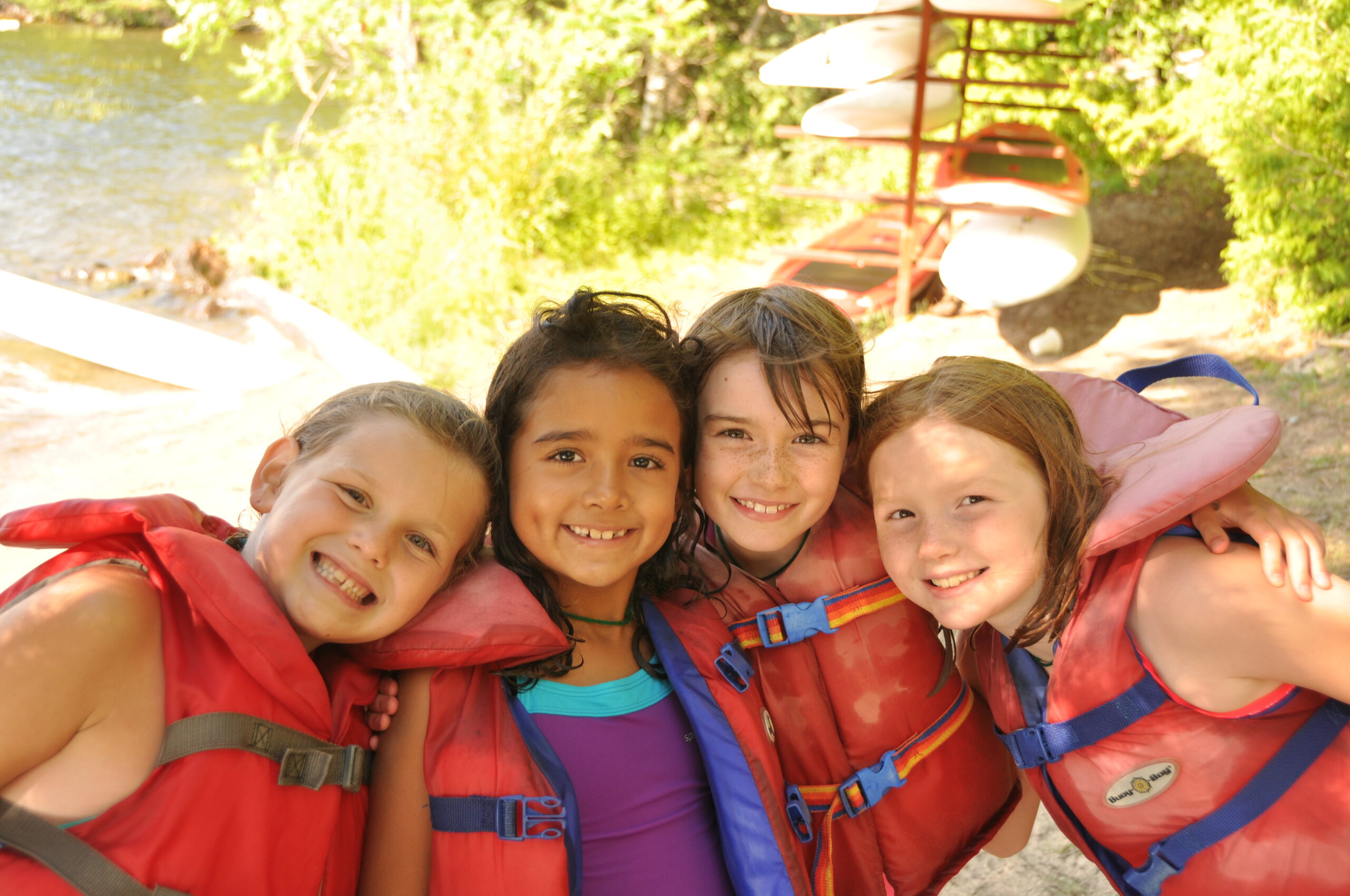 four children in life jackets