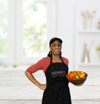 a woman in black apron and cap