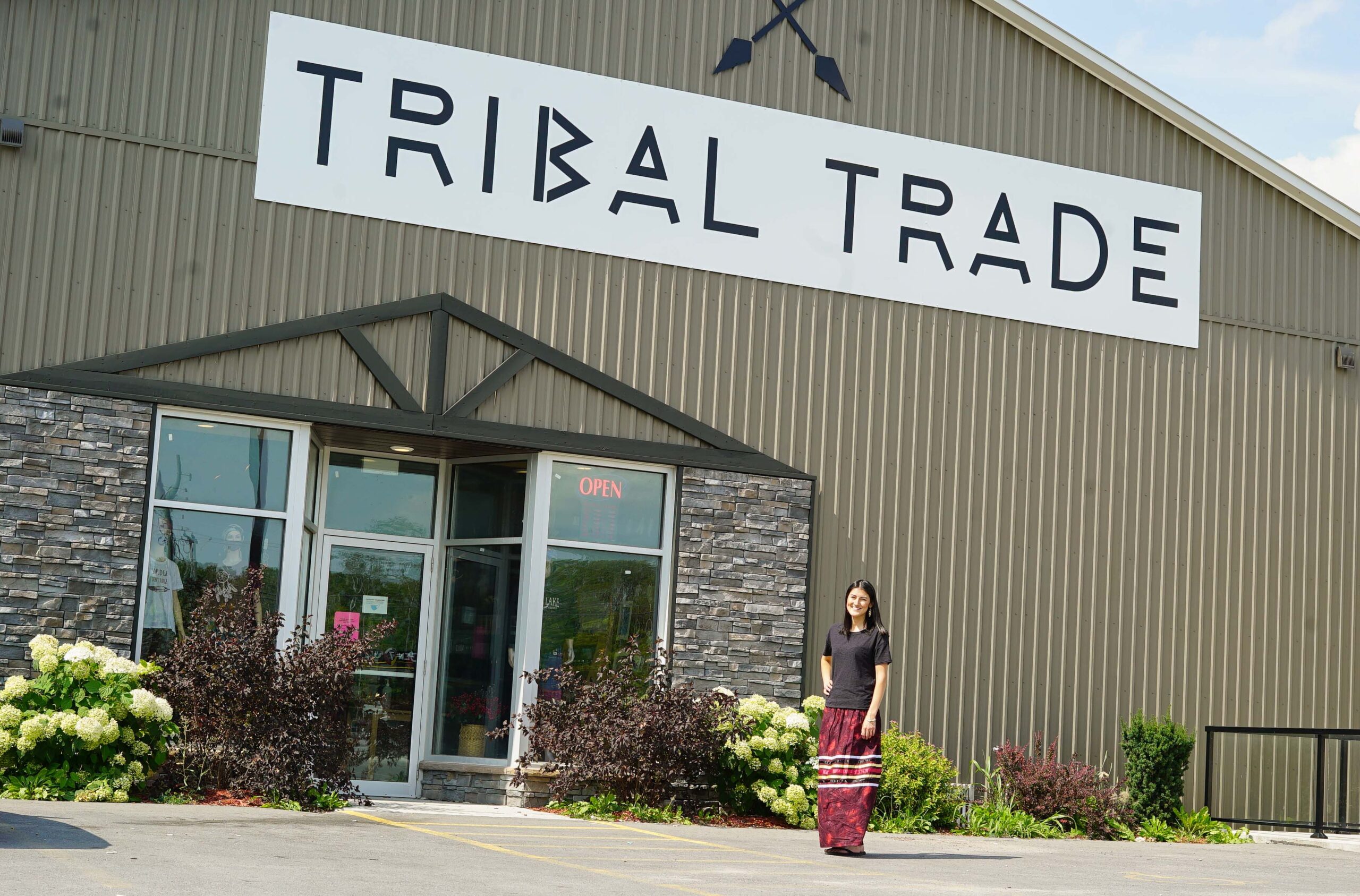 girl in front of tribal trade store