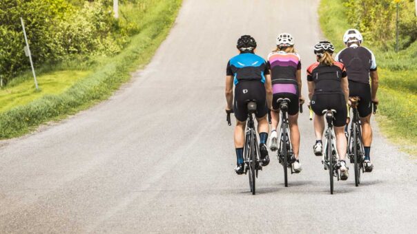 A group of cyclists on a country road