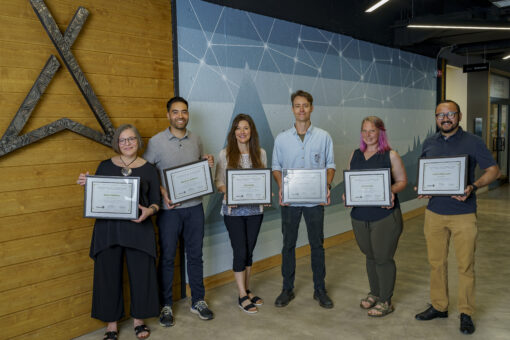 group of local entrepreneurs standing in a line with Starter Company Plus certificates